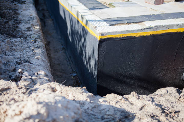 Professional Exterior Waterproofing technician working in Garden City, NY
